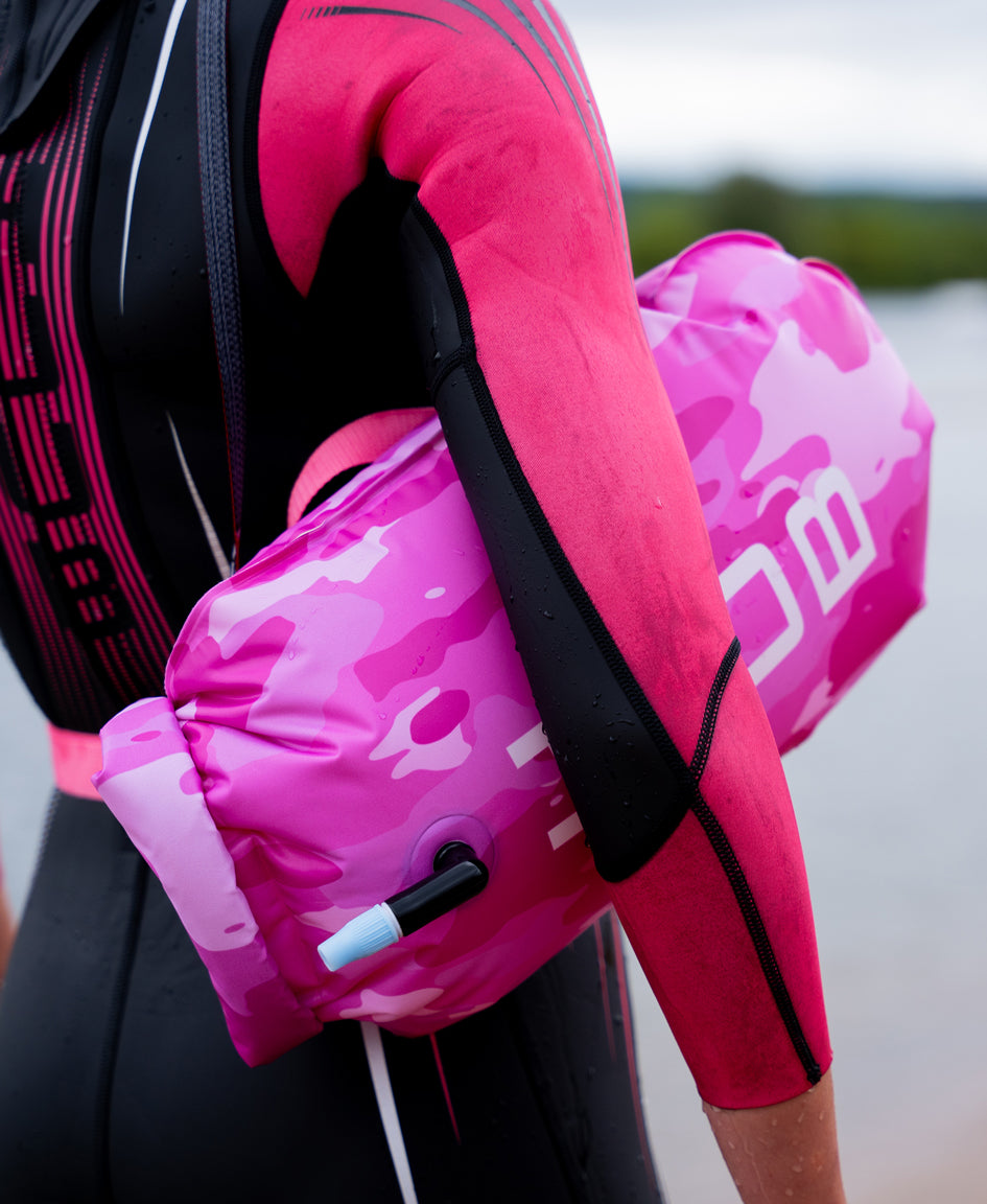 UUB Safety Tow Float pink camo inflatable open water swim buoy, 16L waterproof with waist belt and whistle