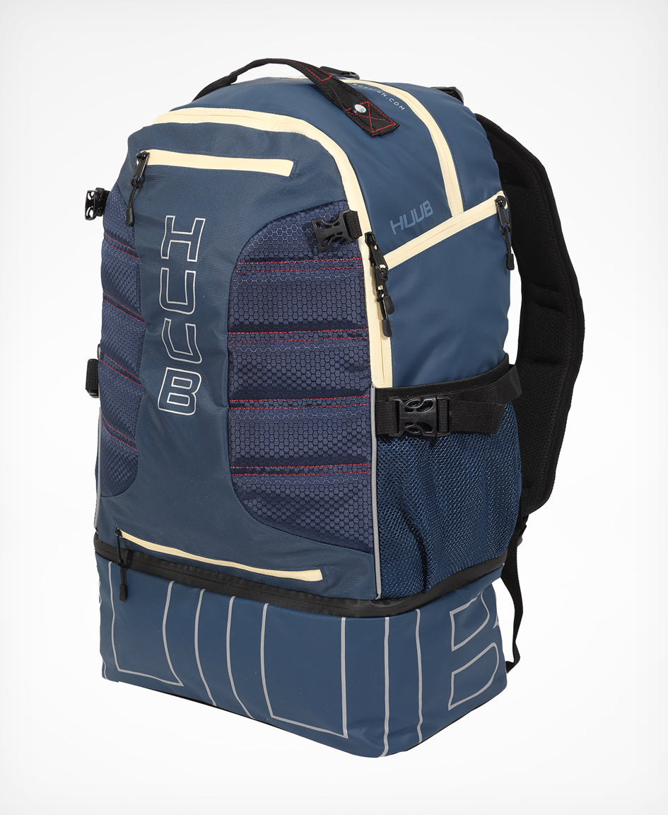HUUB TT Bag – Transition Three, 40L rucksack, wet/dry, hidden helmet cradle, navy and olive/orange.